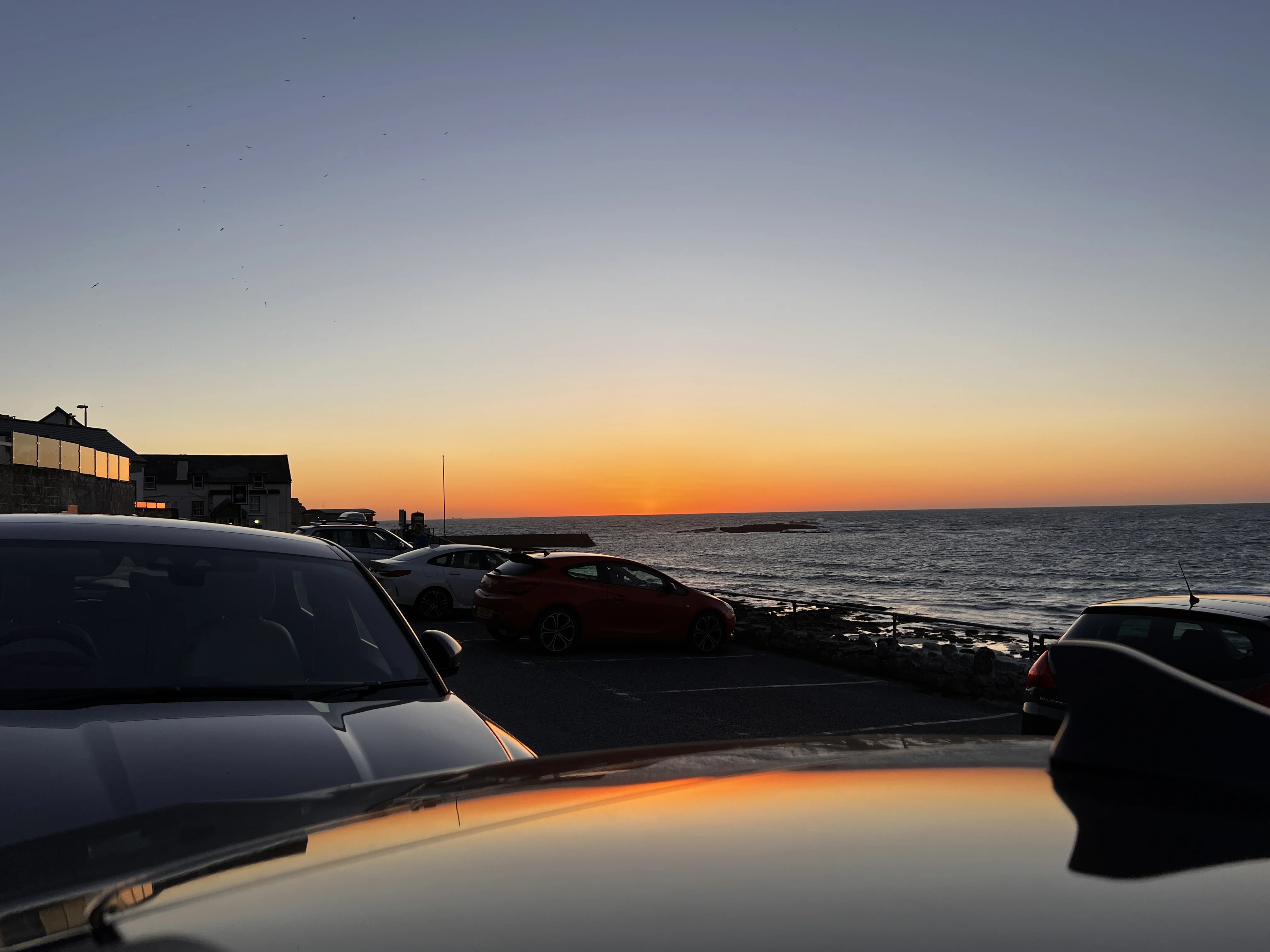 Coastal parking, sunsets creeping through